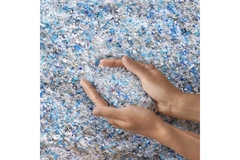 Plastic resins in hand.
